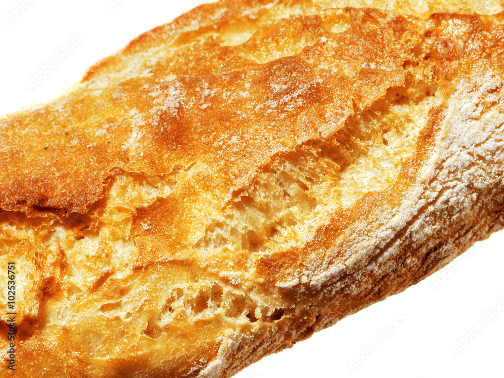 Closeup view of Fresh Baguette, over the white background.