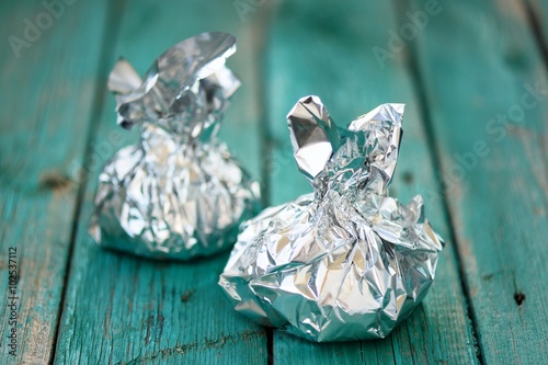 Foil bags on turquoise table selective focus