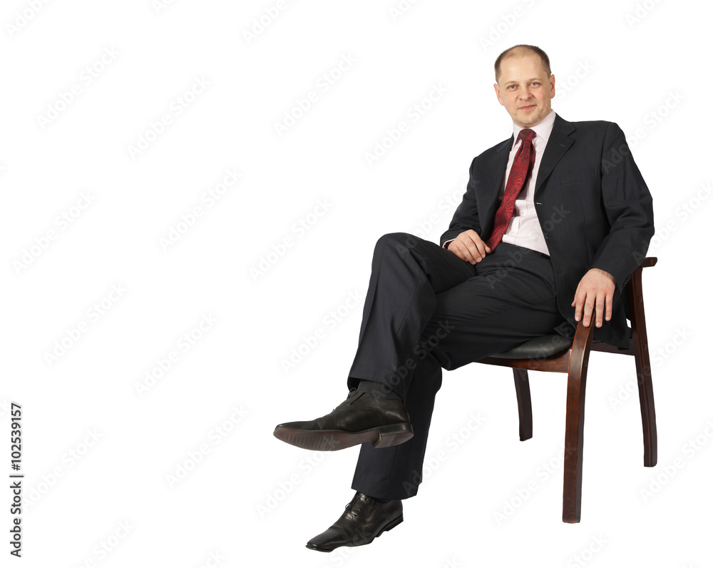 Portrait of a businessman sitting on a chair isolated on white background Portrait of a businessman sitting on a chair isolated on white background