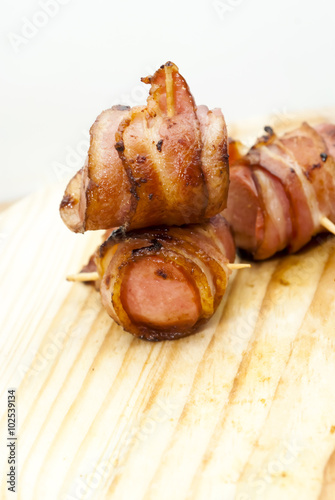 Deep fried sausages rolled in bacon