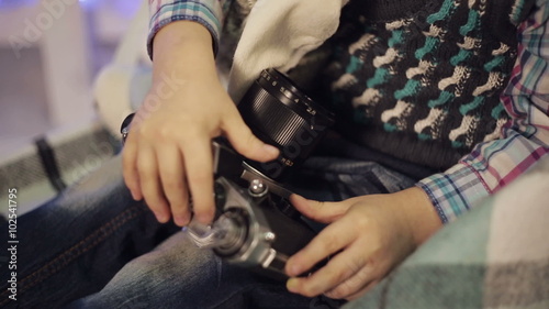 Little boy with old camera photo