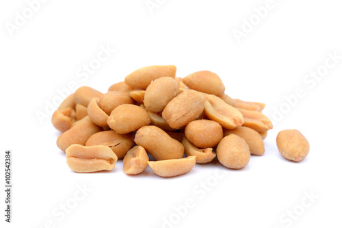 Arranged peanuts peeled and isolated on white background
