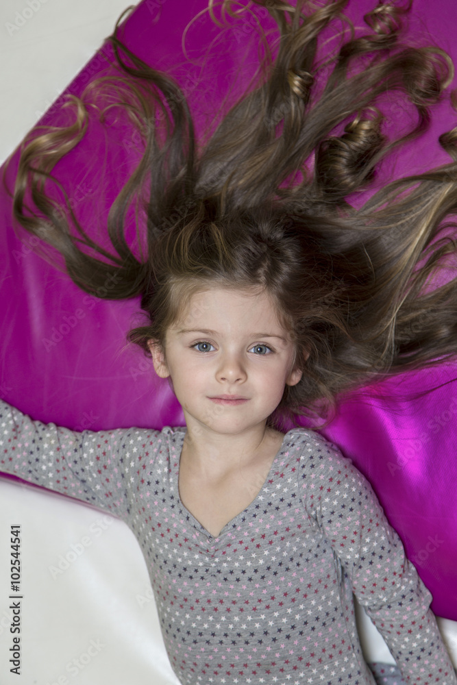 Little girl in the playroom Little girl in the playroom