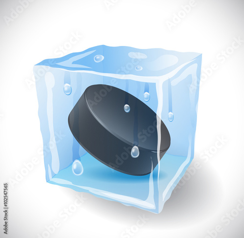 Ice cube with hockey puck . 