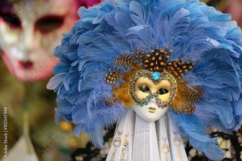 Venetian carnival mask with feather