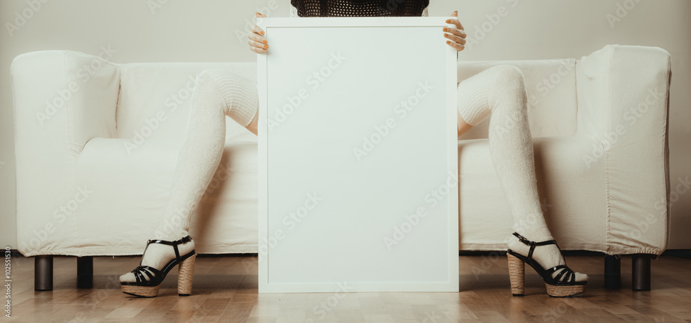 woman legs with blank presentation board.