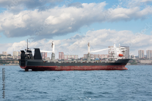 Ship of dry cargo on a background Vladivostok