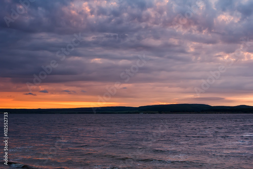 beautiful nature landscape. coast on the lake at dusk