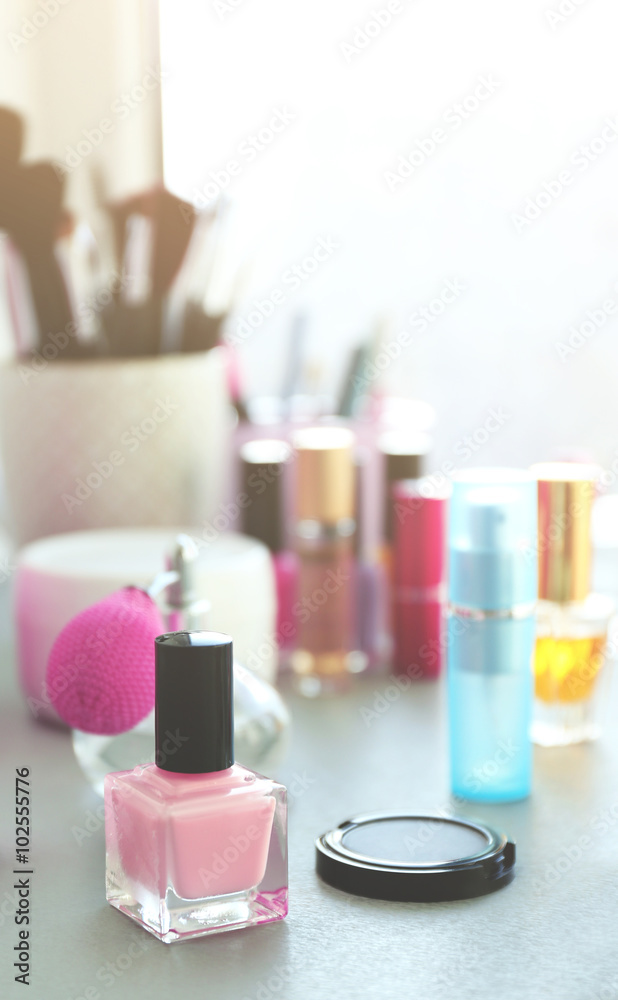 Nail polish with makeup cosmetics on a table Nail polish with makeup cosmetics on a table