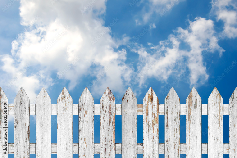 Old wood fence on blue sky background. Old wood fence on blue sky background.