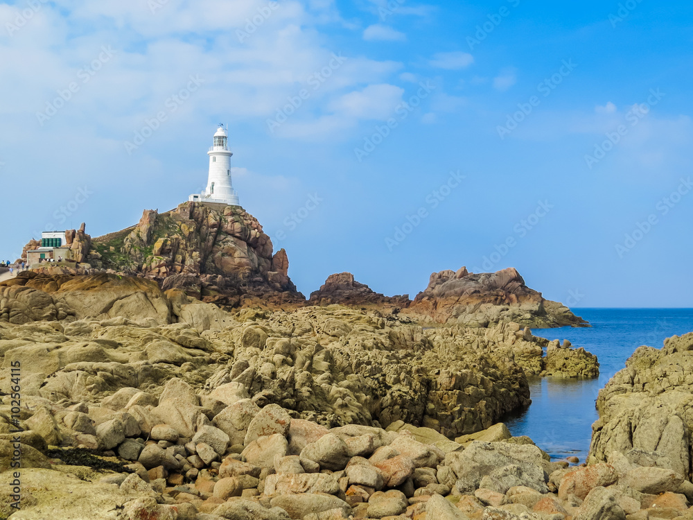 La Corbiere Lighthouse on the rocky coast of Jersey Island La Corbiere Lighthouse on the rocky coast of Jersey Island