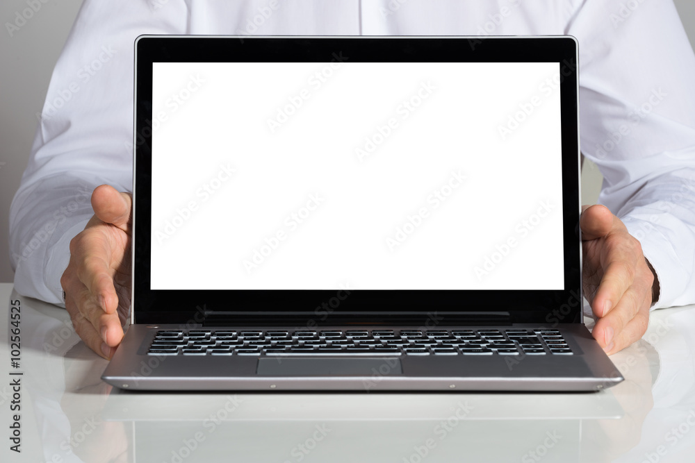 Businessman Showing Laptop With Blank Screen Businessman Showing Laptop With Blank Screen