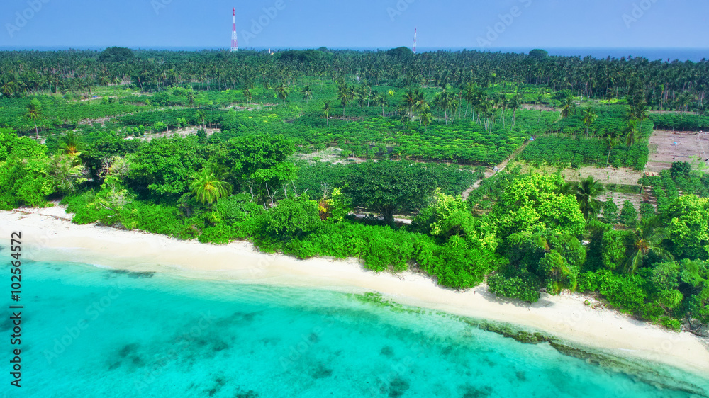 Shoreline of a tropical island in the Maldives and view of the I Shoreline of a tropical island in the Maldives and view of the I
