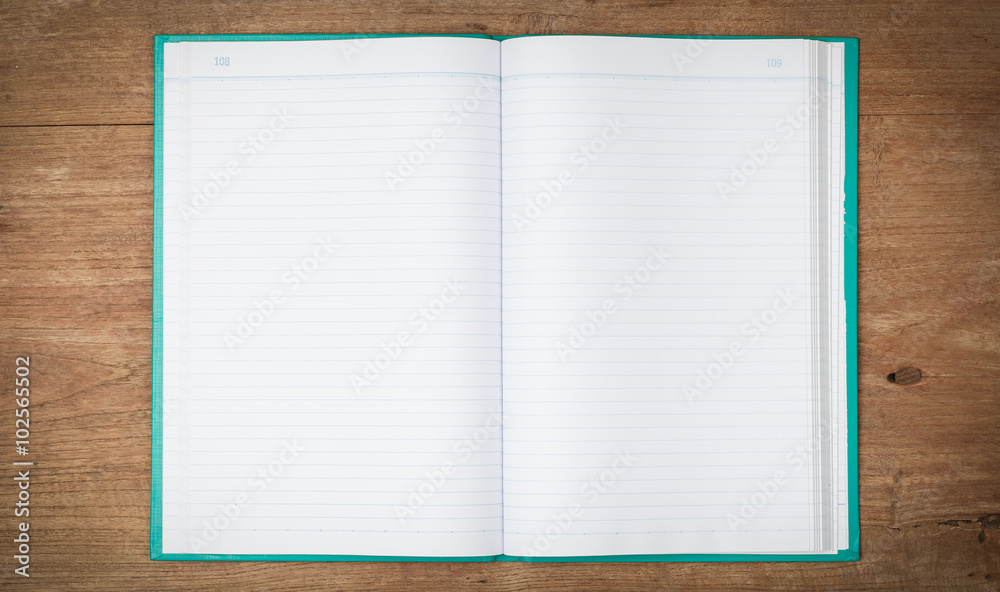 Open notebook on wooden background Open notebook on wooden background