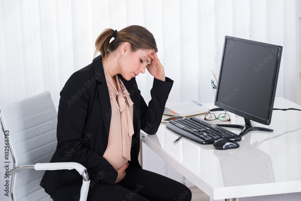 Pregnant Businesswoman Having Headache Pregnant Businesswoman Having Headache