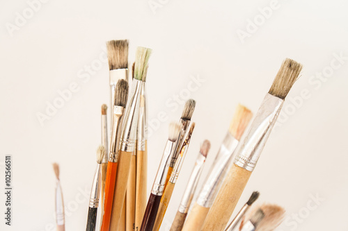 Artist's paint brushes with traces of old paint in bristles