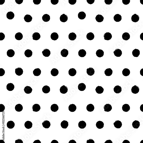 Irregular black and white polkadot seamless pattern