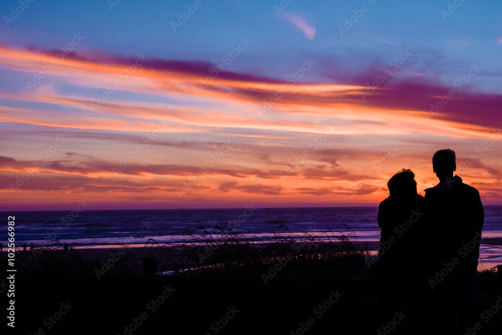 Couple At Sunset On Beach