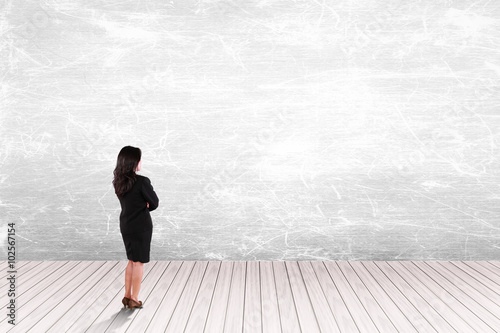 business woman looking on white wall