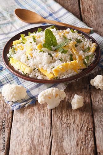 Dietary food: cauliflower rice with scrambled eggs. Vertical 