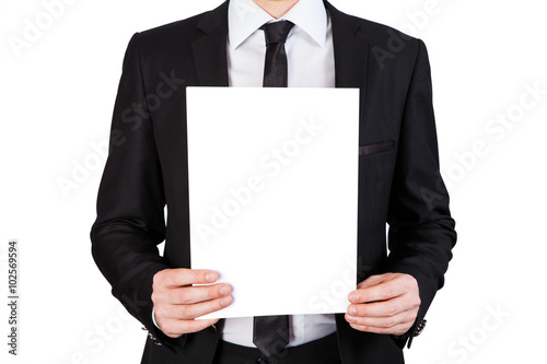 man holding a blank white board