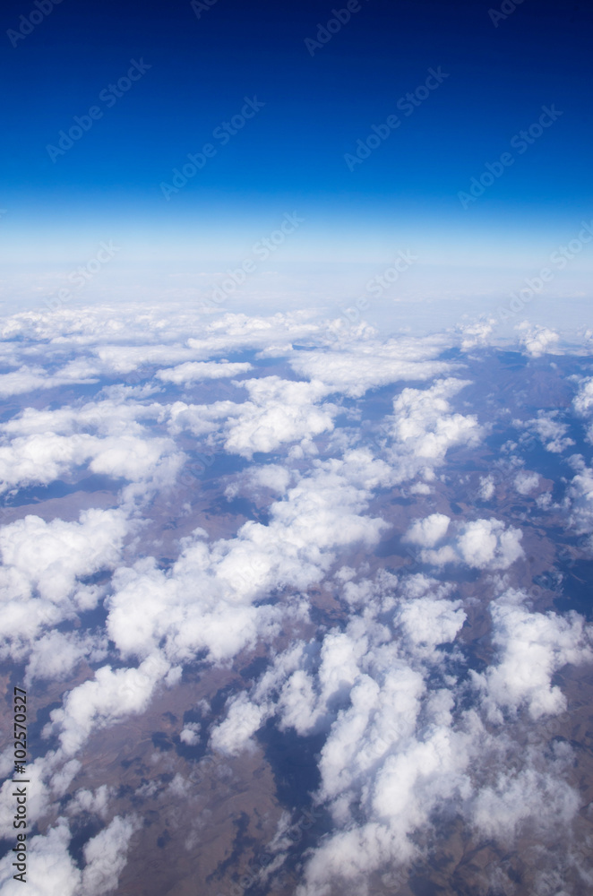 Blue sky background with tiny clouds Blue sky background with tiny clouds