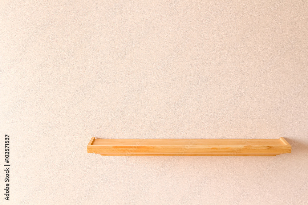Empty wood shelf on pink wall Empty wood shelf on pink wall