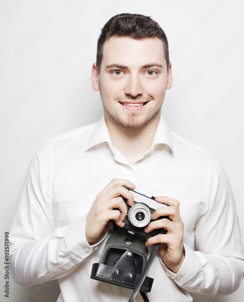 young photographer over white background young photographer over white background