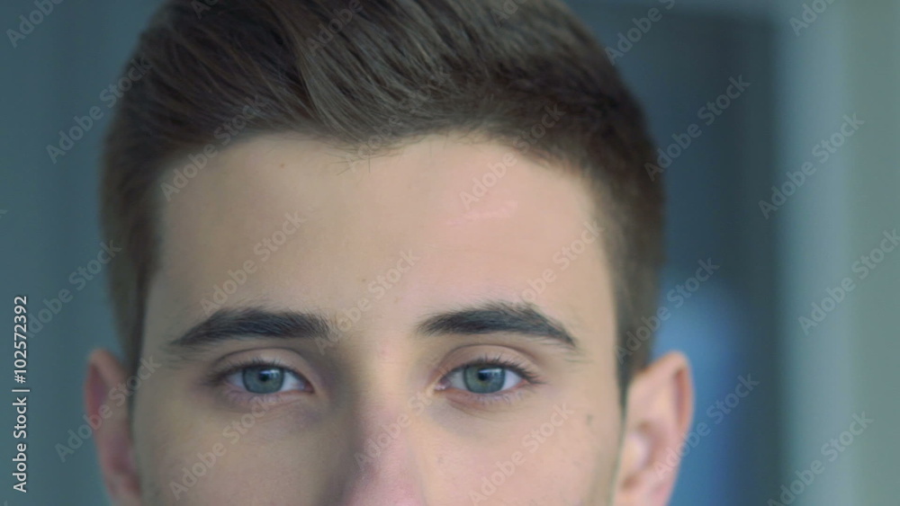 Close up of portrait of handsome young man. Slow motion Close up of portrait of handsome young man. Slow motion