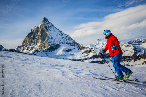Ski tour - skier climbing to the top