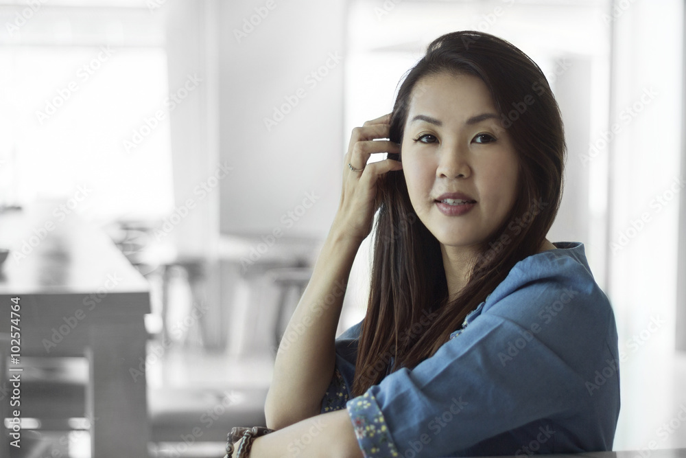 Asian female beautiful women portraits with smile, chinese girl relax life style in the cafe Asian female beautiful women portraits with smile, chinese girl relax life style in the cafe