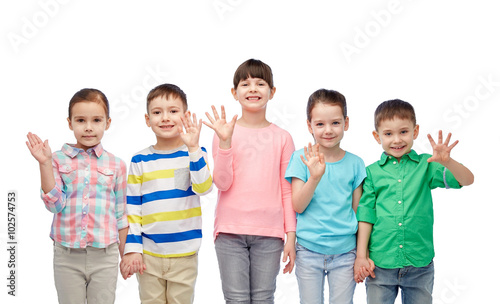 happy smiling little children holding hands