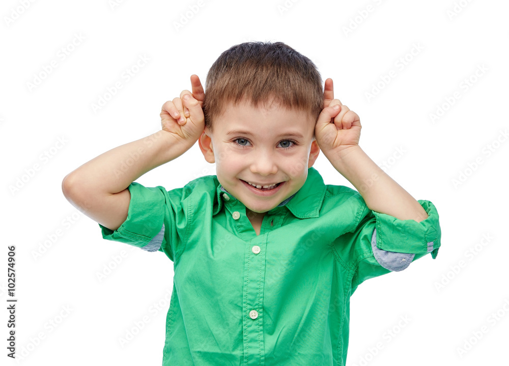 happy little boy having fun and making horns happy little boy having fun and making horns