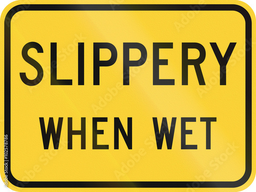 United States MUTCD road sign - Slippery when wet