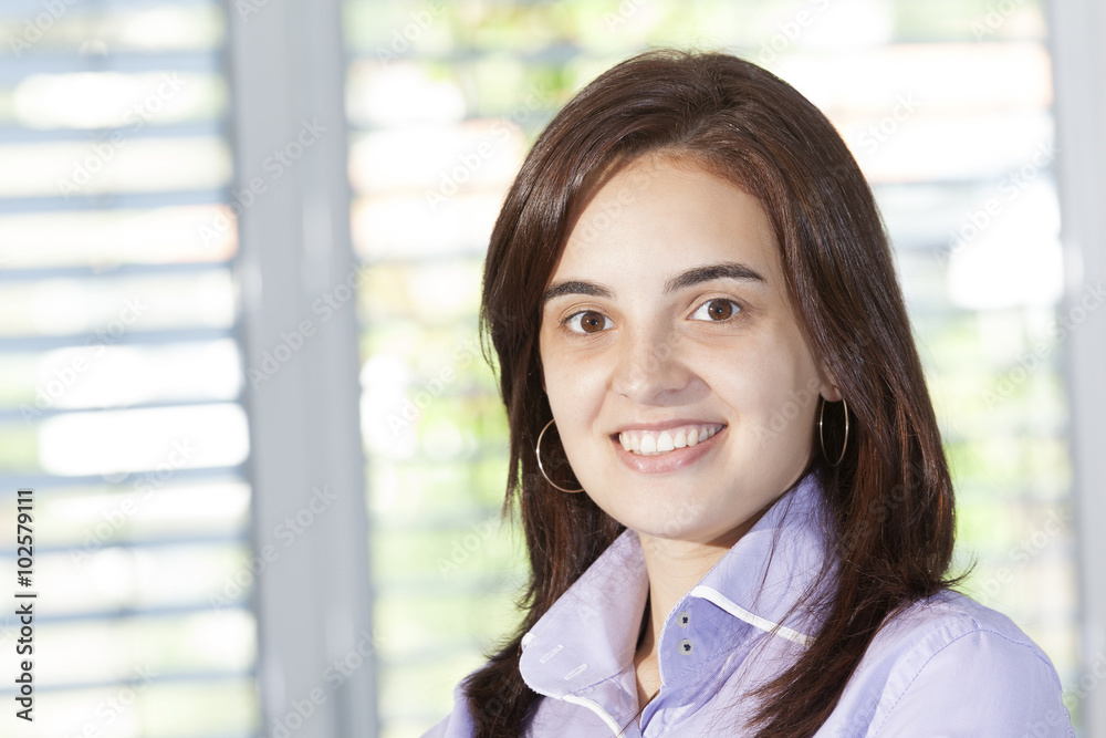 Confident business woman looking confident and smiling Confident business woman looking confident and smiling