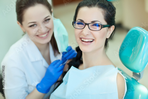 doctor and patient in dentist office 