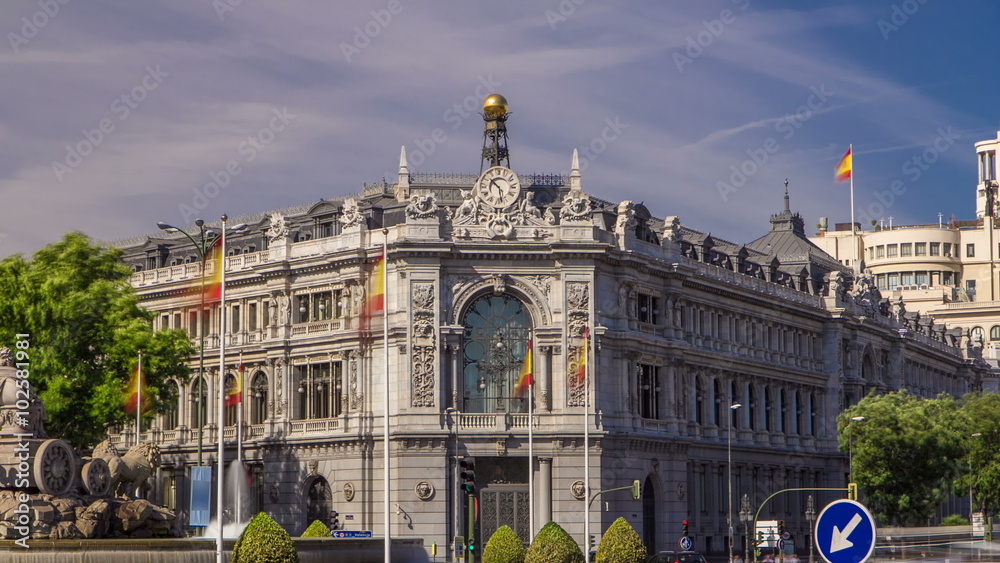 Historic Bank of Spain building timelapse hyperlapse and Cibeles square between Paseo del Prado and Alcala street in Madrid, Spain