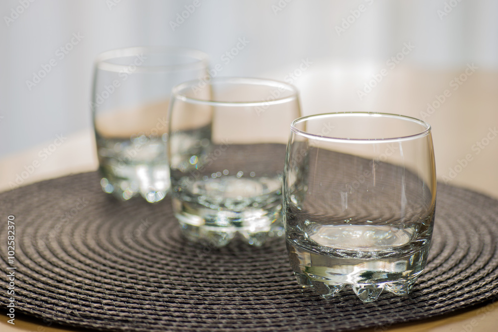 Three empty juice glasses on the table Three empty juice glasses on the table