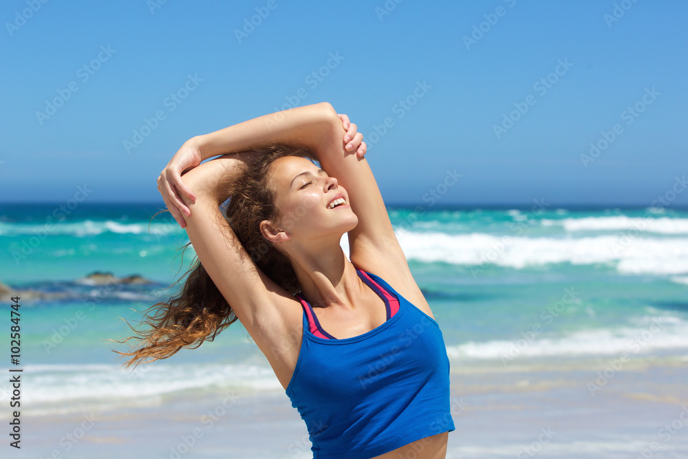 Beautiful young woman enjoying workout at the beach Beautiful young woman enjoying workout at the beach
