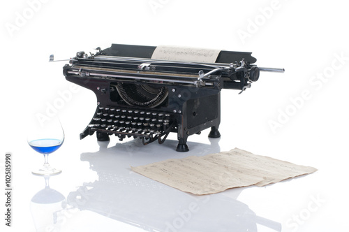 Konstfotografi Old typewriter on wood on a blue background