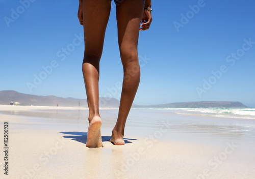 Walking barefoot on beach