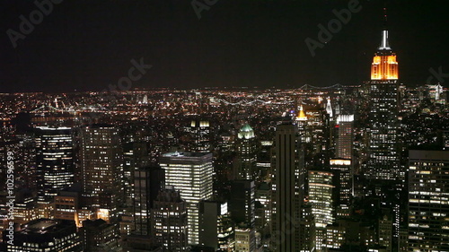 Video footage of the blinking lights of the skyscrapers of mid-town Manhattan, NYC, with the familiar Empire State building dominating the scene right of frame.