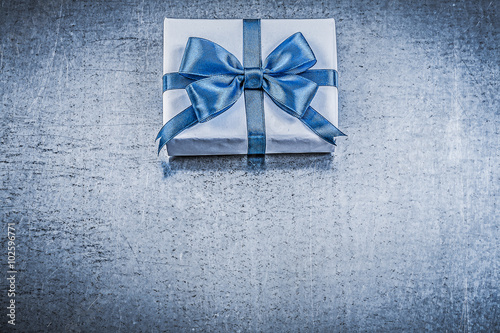 Gift box present tape on metallic background holidays concept © mihalec