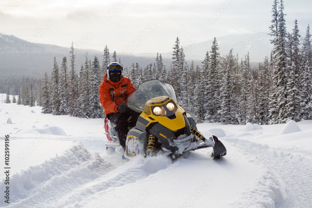 Athlete on a snowmobile.