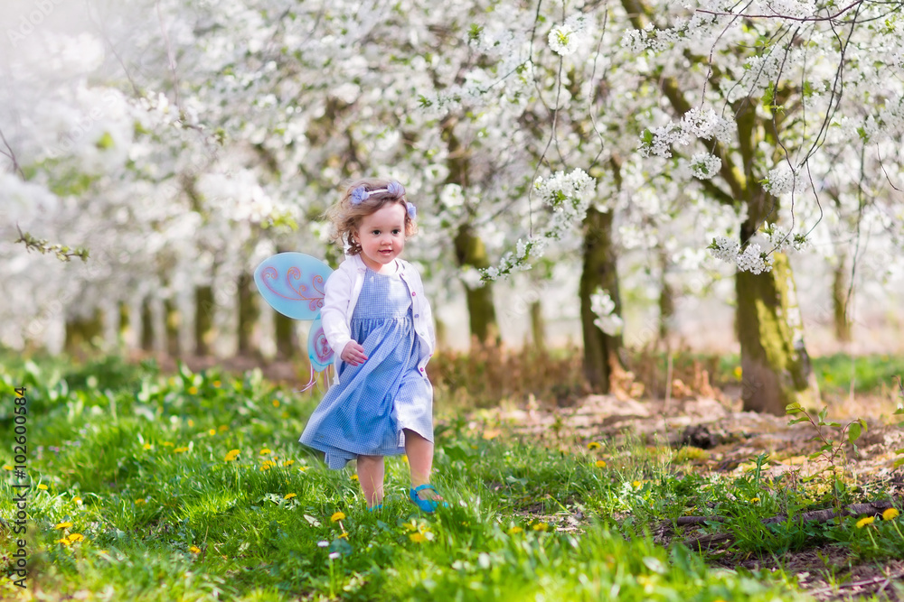 Little girl in apple tree garden Little girl in apple tree garden