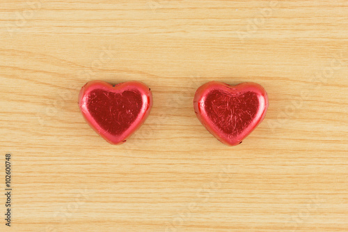 chocolate candy red heart on wooden background.
