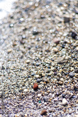 Beautiful beach and shells pebbles on Black Sea with lens bokeh