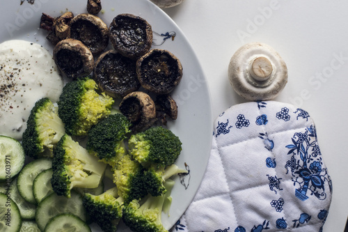 baked mushrooms champignons with broccoli and cucumber