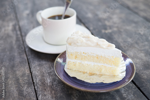 Coconut cake and coffee cup on the table