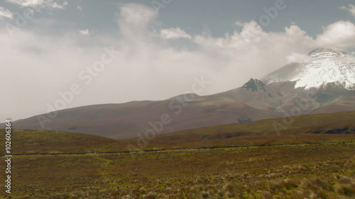 Breathtaking panning shot captures the majestic Ecuadorian Andes Mountains,commencing at the iconic Cotopaxi Volcano.